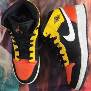 Jordan Black and Gold Sneakers